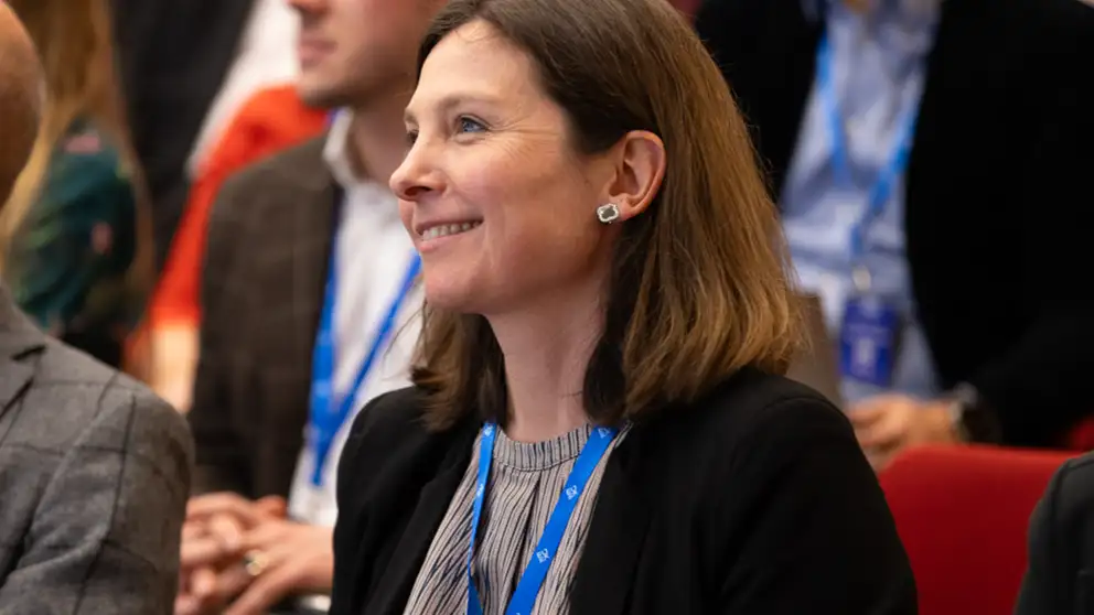 Woman listering to presentation.