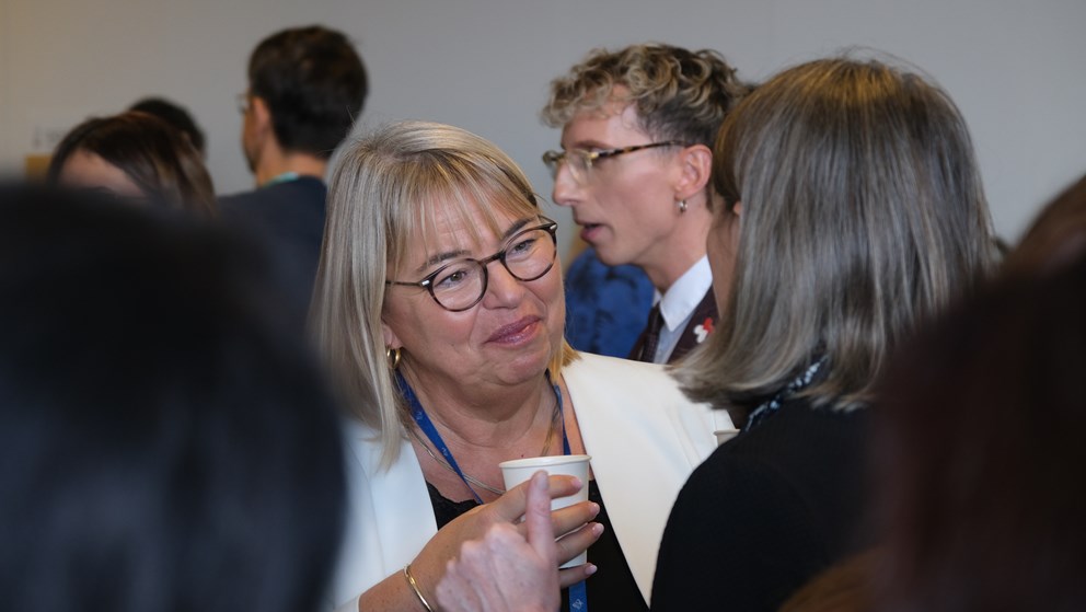 Two women drinking coffee and networking