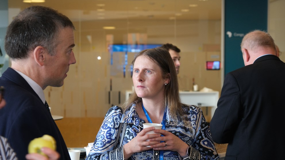 Man and woman drinking coffee and networking